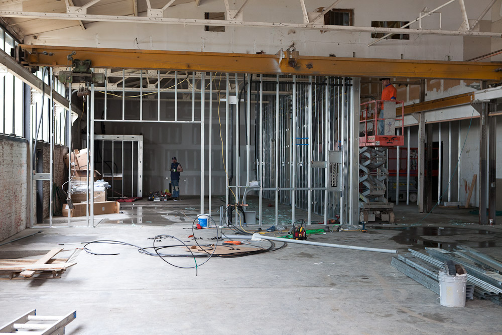 Workers frame up walls in the cold working space