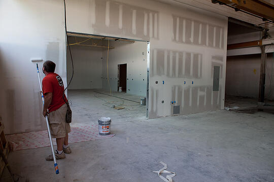 One of the HG Construction guys finishes the new paint job