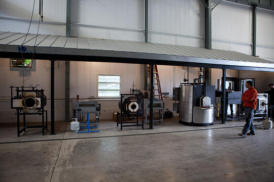 Jonathan walks past the new equipment in the hot shop