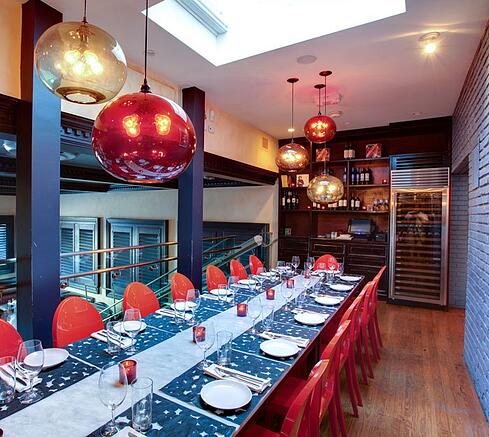 Terra Modern Pendant Lighting over dining arrangement at Sra. Martinez