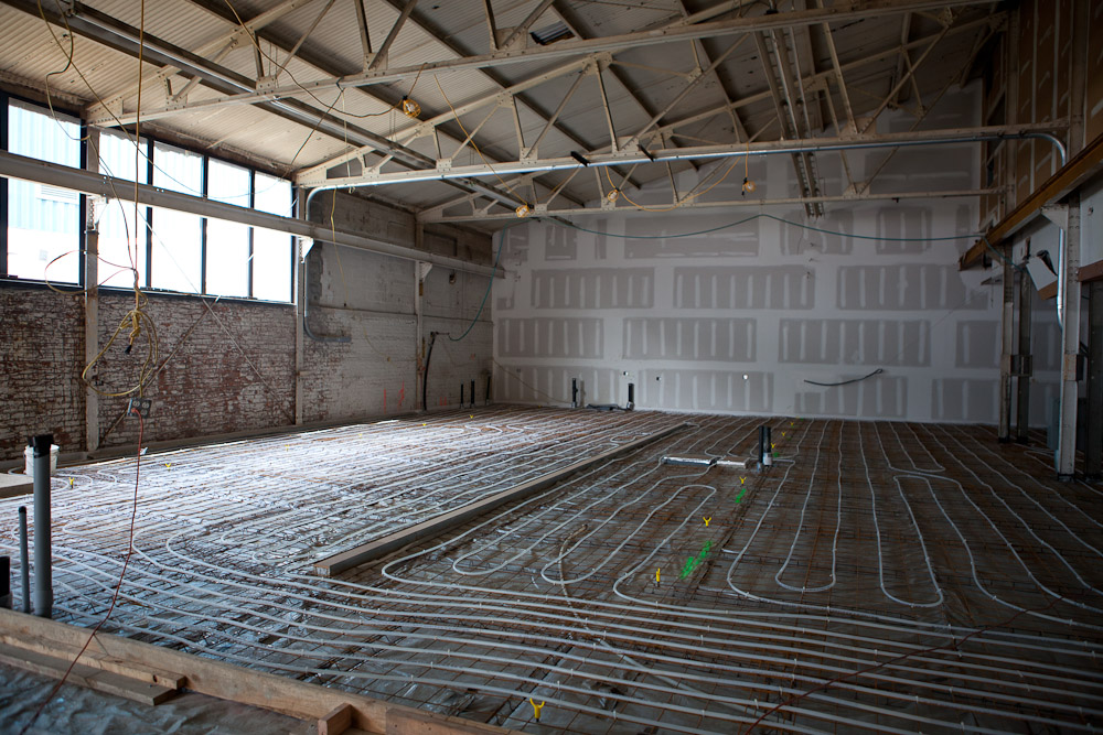 Tubes for radiant heating wrap back and forth across the cold shop