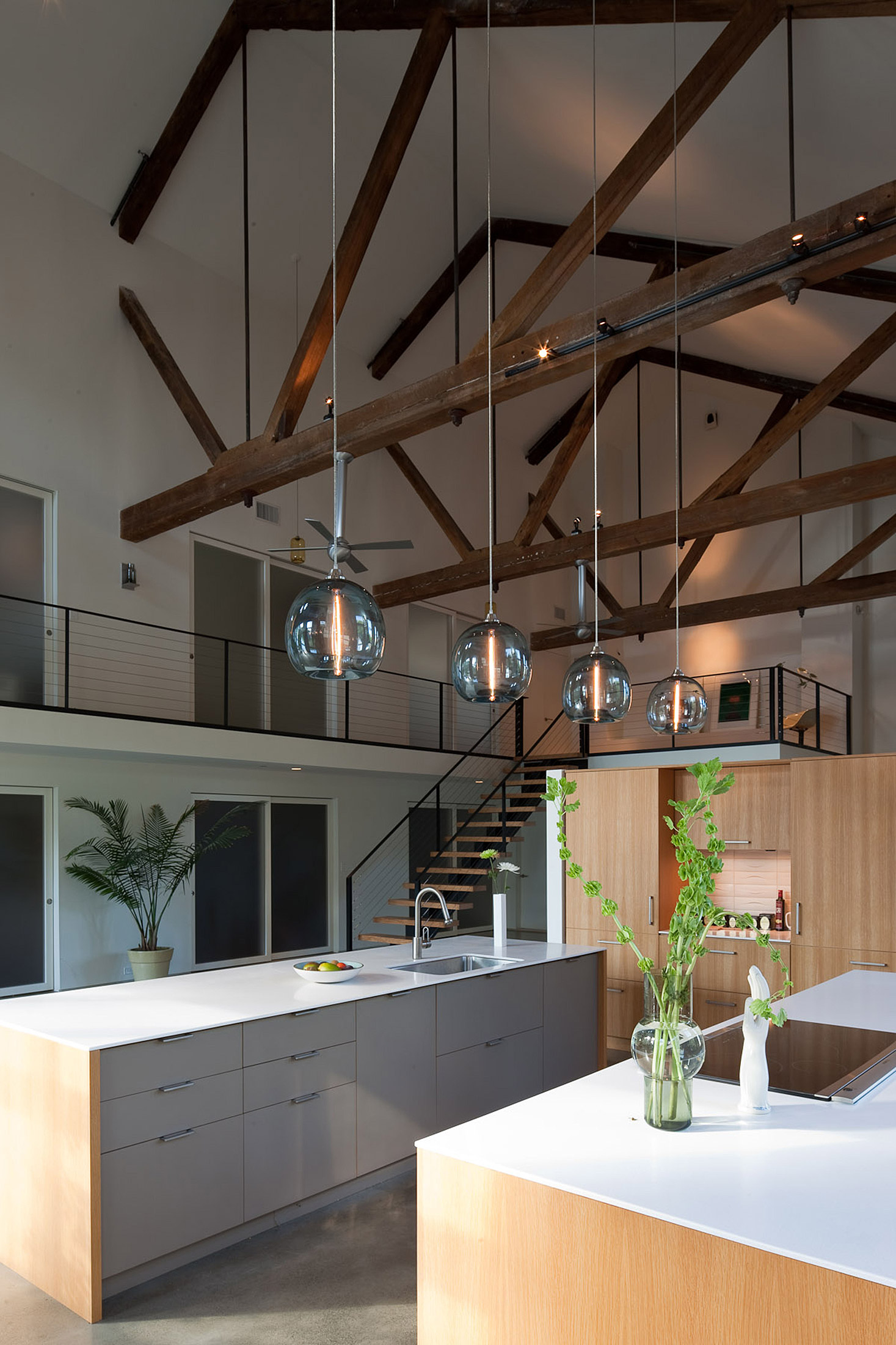 Four Stamen Pendant Lamps over a kitchen island