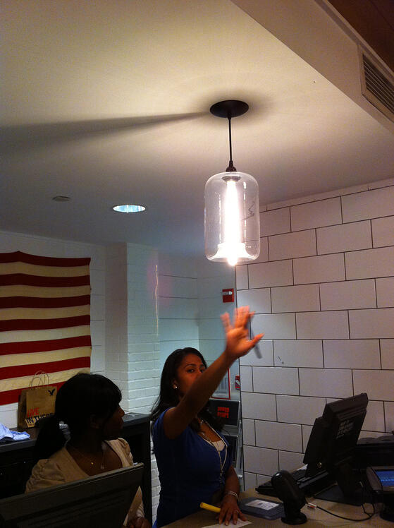 A Niche Modern Pod Pendant hanging at American Eagle Outfitters in Times Square