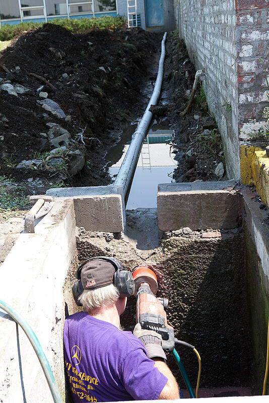 A trench is dug directing internet lines down from the offices