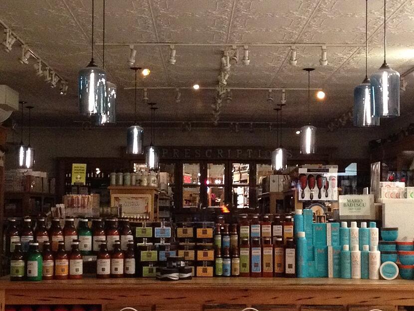 Avignone Chemists Interior featuring Niche Modern Bella Pendant Lights