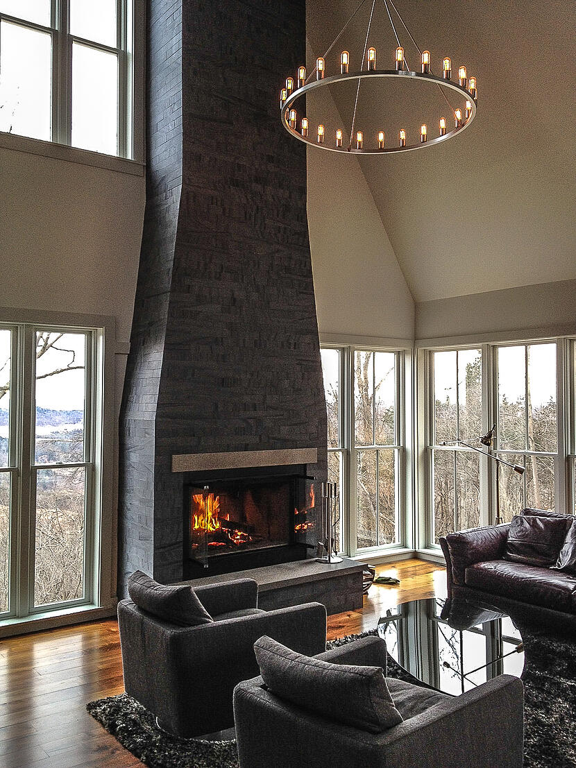 Niche Spark Modern Chandelier hanging above a living room space