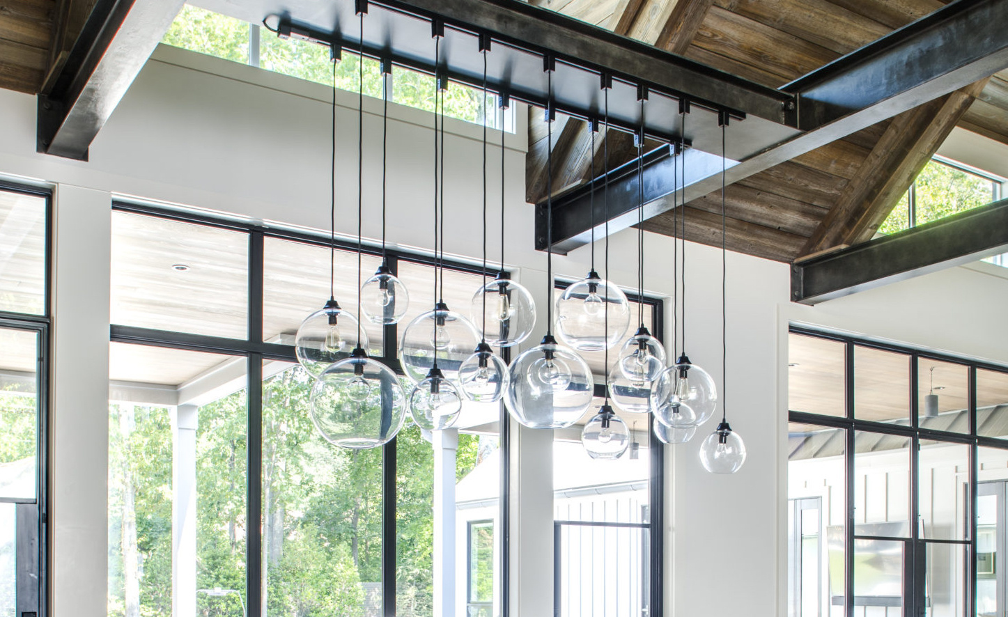 Track Lighting with Niche Crystal Solitaire and Solitaire Petite lighting pendants