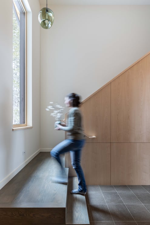 beautiful green glass lighting pendant hangs in stairwell, Niche's Moss Stamen