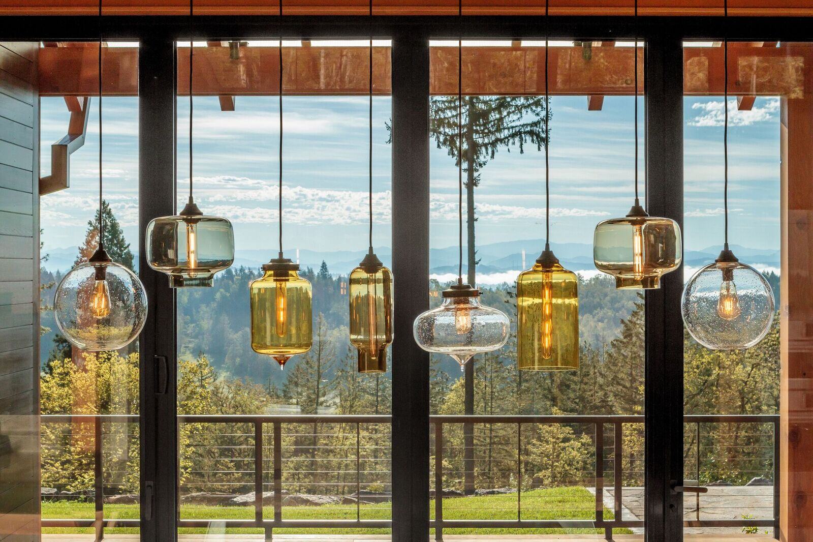 Timberidge home by 2form architecture with Niche handmade glass lighting pendants Effervescent Solitaire, Smoke Oculo, Amber Bella, Smoke Pharos, Amber Turret, Effervescent Minaret, Grey Oculo, opaline pharos