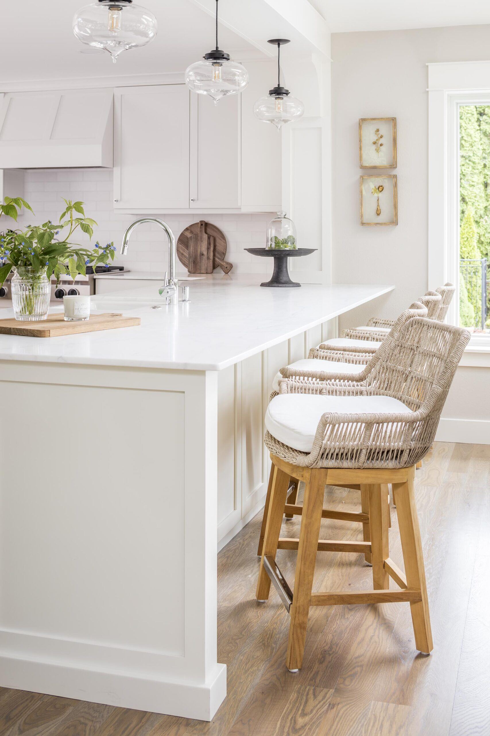 Three Handmade Glass Pendant Lights in an All White Kitchen