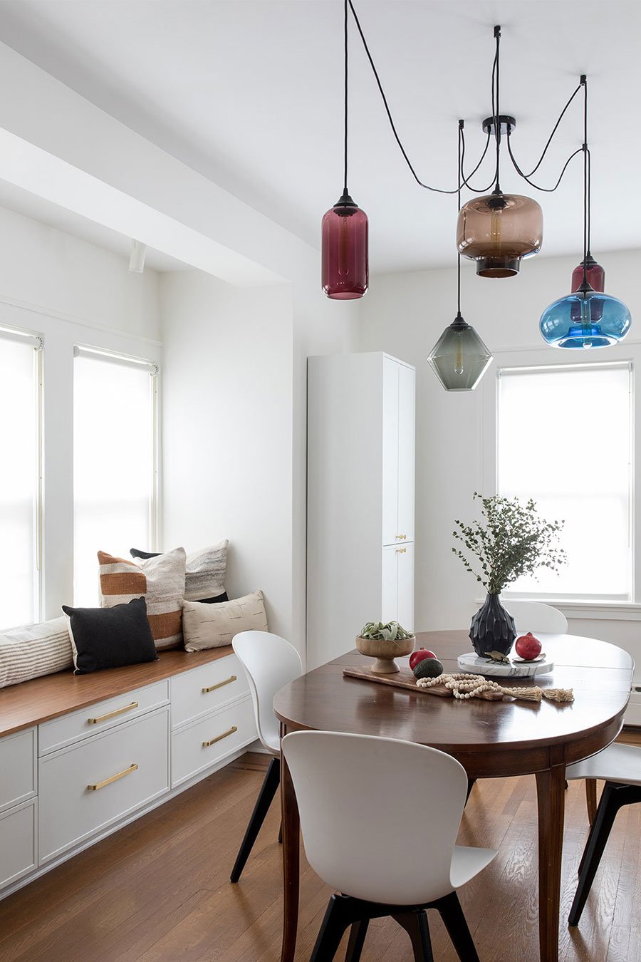Thayer Woods - Queens, NY Dining Room Featuring a Mix of Handmade Glass Pendant Lights